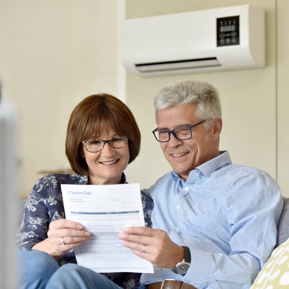 A couple at home planning how to keep one room comfortable